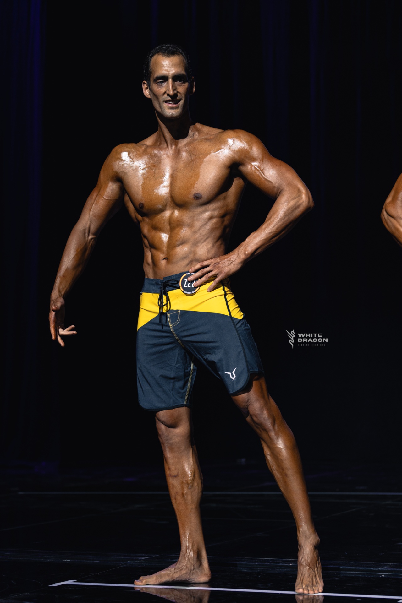 Coach Lou on stage — front pose